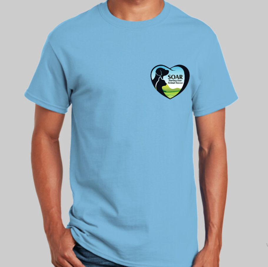 A model wearing a light blue shirt with the SOAR logo on their left chest.